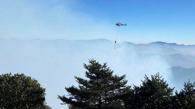 Helicopter used to douse fire near Pathivara Temple