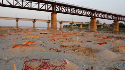 Indian police find bodies on riverbank amid raging COVID-19