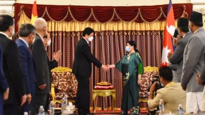 President Bhandari and Li sit for courtesy meeting